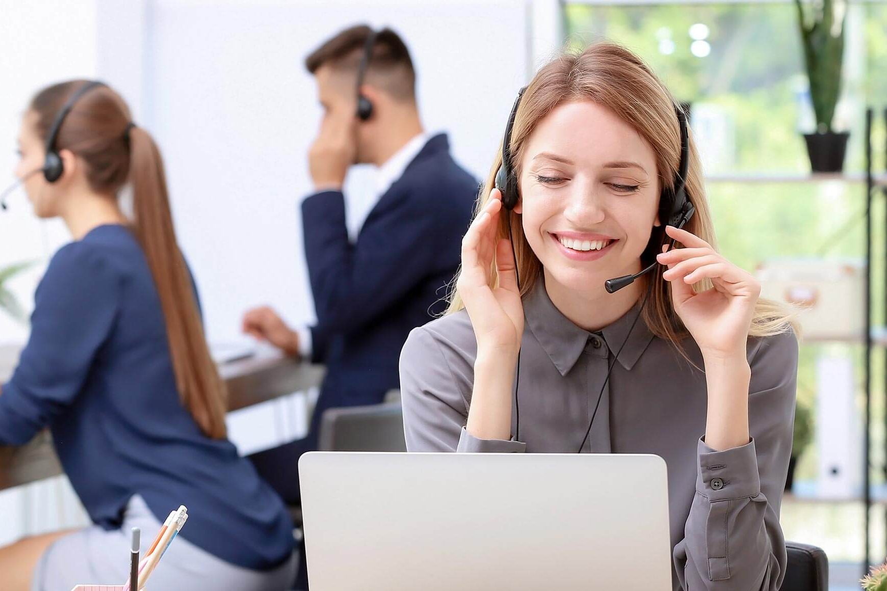 Call center and customer support services in Milwaukee, Wisconsin with headset-wearing agents, live chat interfaces, and 24/7 customer service solutions for local businesses.