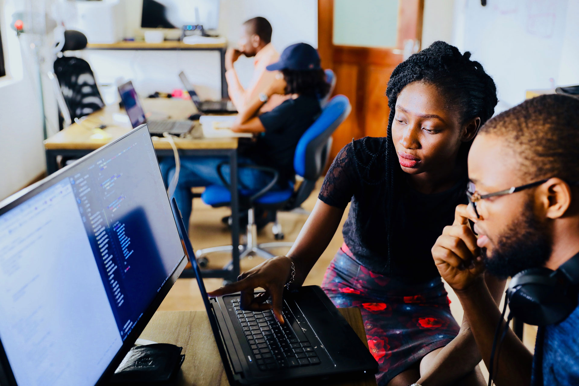 Managed IT Services in Milwaukee, Wisconsin featuring coding on screen, IT infrastructure support, and secure custom software solutions for local businesses.